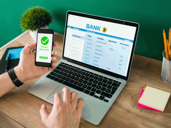 wire-transfer-young-man-using-his-smartphone-laptop-banking-transaction-some-payments